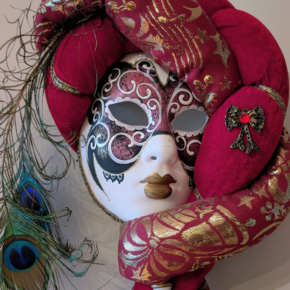 Elegant Red and Gold Venetian Mask with Peacock Feather